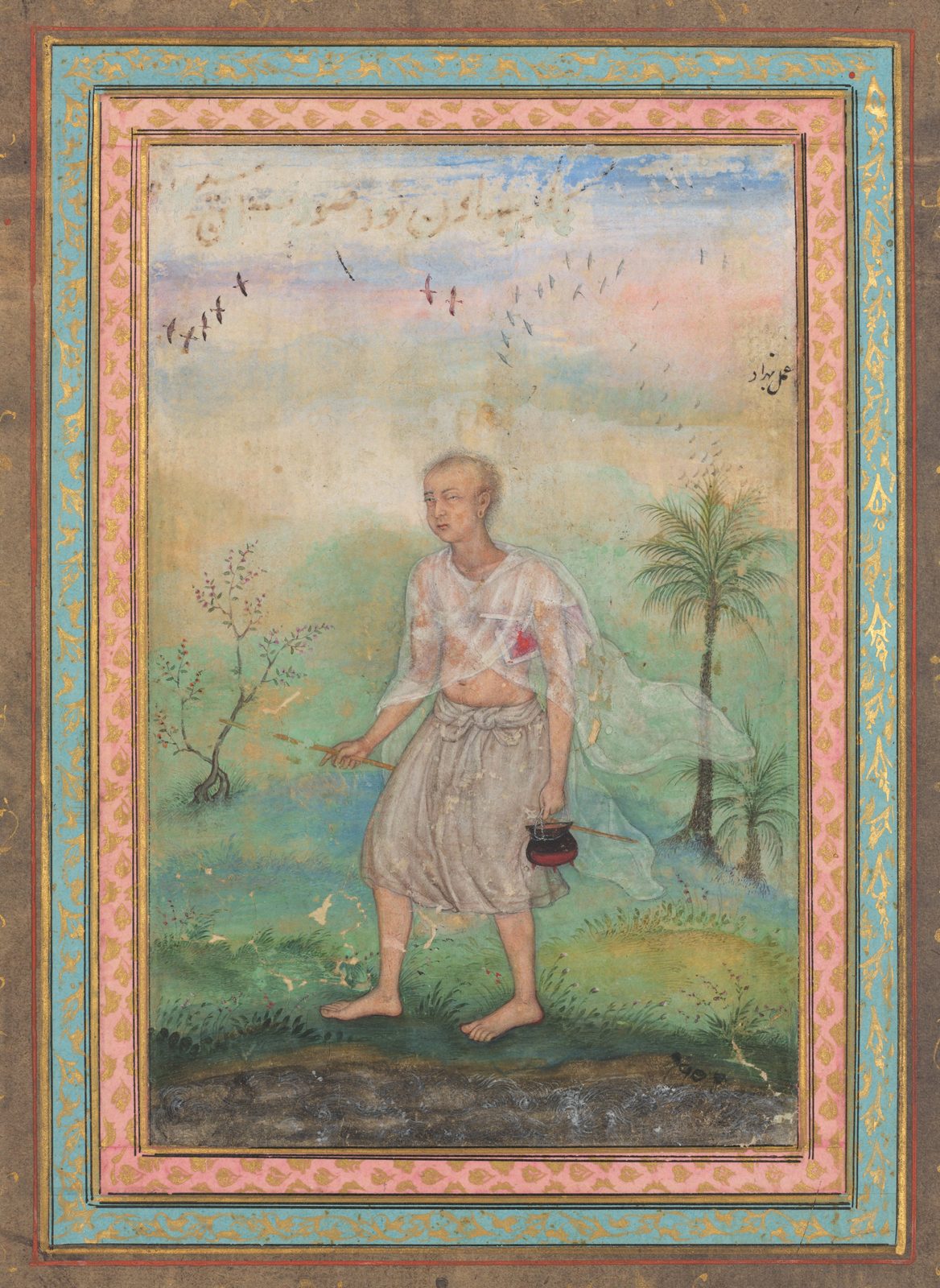 A small Mughal miniature painting mounted on a larger album sheet. A Jain monk in white robes walks along a riverbank, a manuscript bound in a red cover held under his left arm, and carries the plain equipment of an ascetic: a staff, a whisk broom and a small pot.