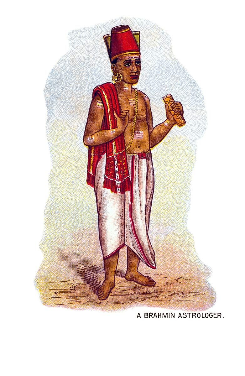 A colour lithograph postcard printed on white paper, taller than it is wide. A young man stands barefoot on a thin strip of pale ground, turned slightly to his left, with no scenery behind him except a soft cloud-shaped wash of blue and cream. He wears a tall red cap with a flat top, gold hoop earrings, a red shoulder cloth edged in gold hanging from his left shoulder, a white dhoti with a red border, a gold chain and a string of beads, and a thin pale thread across his chest. Light-coloured marks are painted on his forehead, upper arms and chest. His right hand rests near his chest and his raised left hand holds a small folded booklet of pale paper or palm leaf. Under the figure, in small black capitals, are the words A BRAHMIN ASTROLOGER.