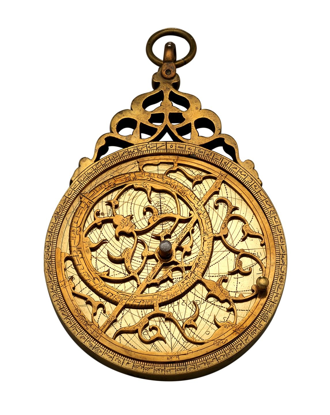 A gilt brass planispheric astrolabe photographed front-on against plain white, fully assembled. The pierced rete of curl