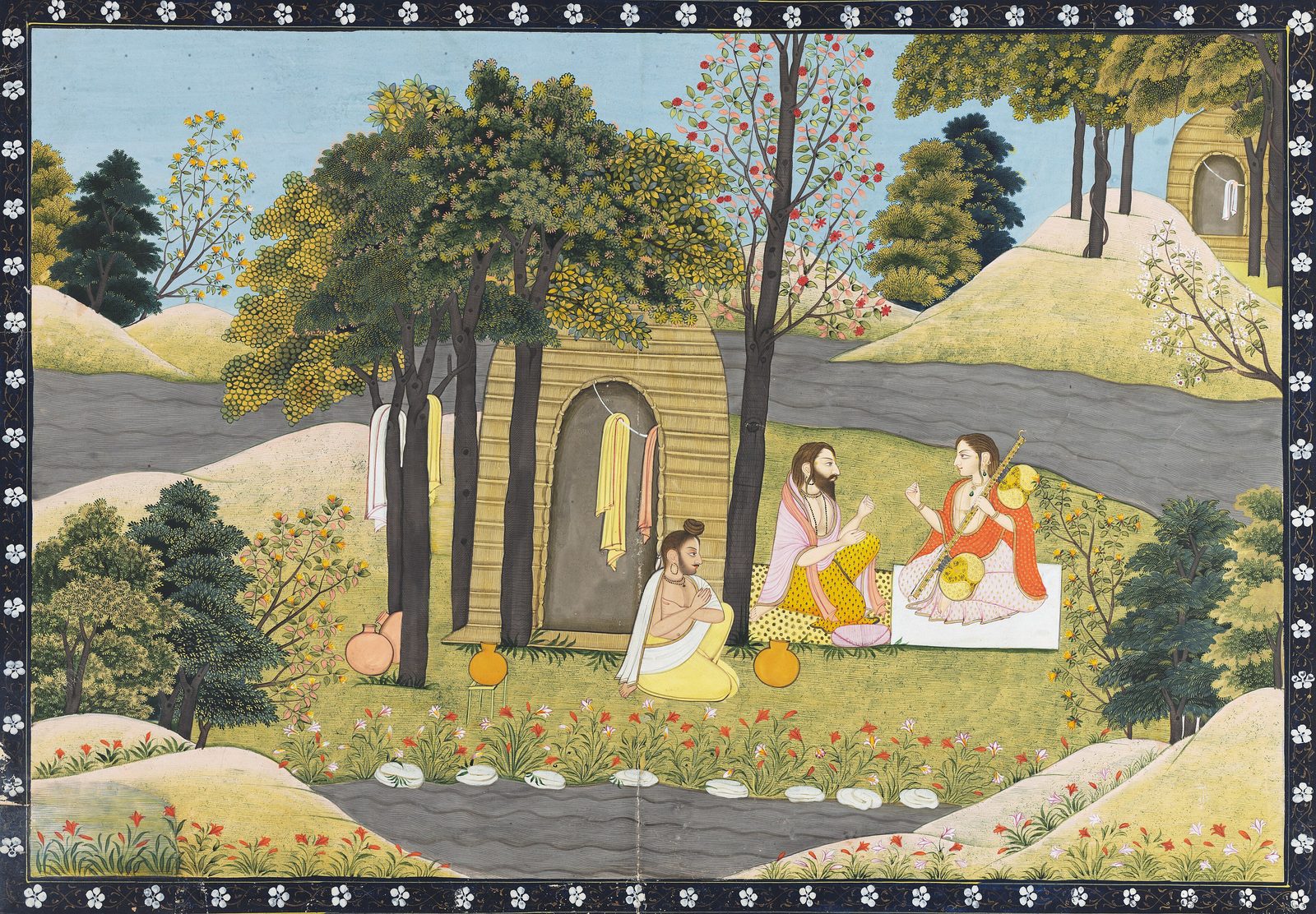 An Indian miniature painting of a hermitage clearing. Two bearded sages sit facing each other on the grass outside a tha